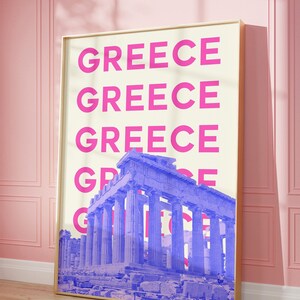 May include: A poster with a white background and the word "GREECE" repeated in pink letters. A blue image of the Parthenon is superimposed over the text.