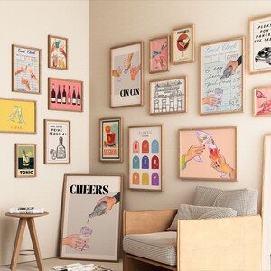 May include: A wall gallery featuring various framed prints with a cocktail theme. The prints include illustrations of cocktails, bar scenes, and text related to drinking. The prints are in a variety of colors and styles, and they are arranged in a visually appealing way.