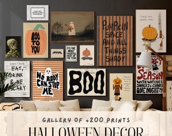 May include: A gallery wall featuring various Halloween-themed art prints. The prints include pumpkins, ghosts, and spooky phrases like "Boo to You" and "No Body Can Stop Me." The overall color scheme is orange, black, and white.