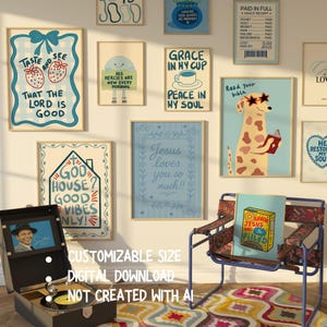 May include: A collection of framed art prints with inspirational quotes and illustrations, including a dog reading a book and a cup of coffee. A vintage record player sits in the foreground.