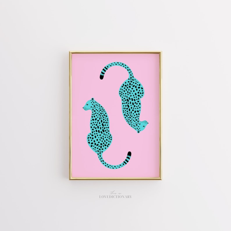 May include: A framed print with two turquoise cheetahs with black spots on a pink background. The text "there is LOVE DICTIONARY" is at the bottom of the print.