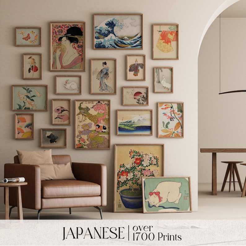 May include: A gallery wall featuring over 1700 Japanese prints. The prints are framed in wood and feature a variety of subjects, including landscapes, flowers, animals, and people. The prints are arranged in a grid pattern on a white wall.