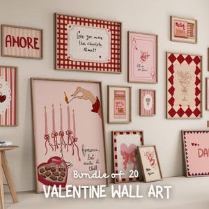 May include: A collection of 20 Valentine's Day themed wall art prints in various sizes and designs. The prints feature romantic illustrations, phrases, and a color palette of pink, red, and white. Some prints include the word "AMORE".