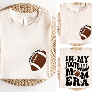 a t - shirt with a football on the front and a football on the back