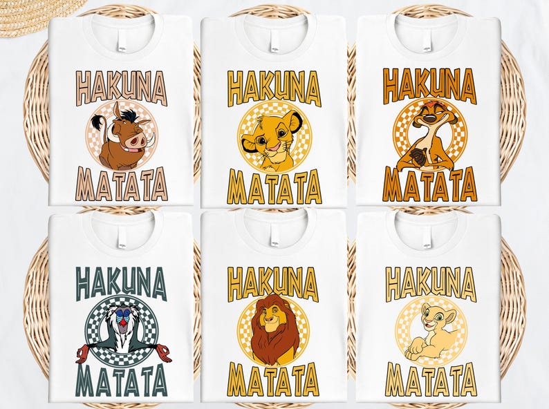 six white t-shirts with the text "HAKUNA MATATA" printed on them, featuring illustrations of the main characters from the Disney film "The Lion King".