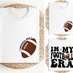 a t - shirt with a football on the front and a football on the back