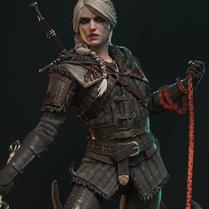 May include: A detailed figurine of a woman with white hair, wearing a dark, textured outfit with a belt and sword. She holds a red chain. The figurine has a serious expression and is a collectible item.