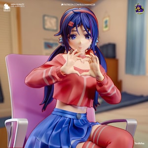 May include: A 3D printed figurine of a young woman with blue hair and a pink sweater, making a heart shape with her hands. She is wearing a blue skirt and red and white striped stockings. The figurine is sitting on a pink chair.
