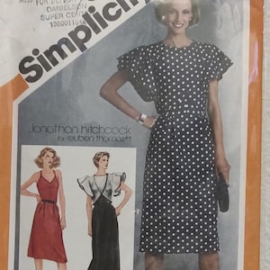 May include: A sewing pattern featuring three different dress designs. The first dress is a black and white polka dot dress with short sleeves and a round neckline. The second dress is a red dress with a halter neckline and a fitted bodice. The third dress is a black dress with a V-neckline and a fitted bodice. The pattern is from Jonathan Hitchcock for Reuben Thomas.