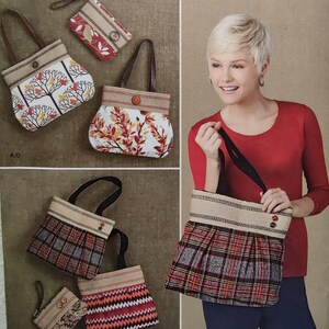 May include: Simplicity pattern 1519 featuring various tote bags and small purses. Designs include bags with tree, leaf, plaid, and chevron patterns. The bags have brown handles and button closures. The pattern includes the text "U.S. ONE SIZE".