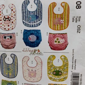 May include: McCall's M6108 sewing pattern envelope featuring illustrations of baby bibs and diaper covers. Designs include monkey, fish, ladybug, elephant, crown, and frog motifs with various patterns like stripes, polka dots, and floral prints.