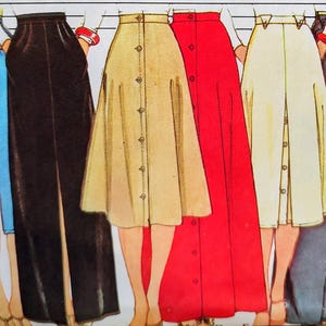 May include: A sewing pattern illustration titled MISSES' SET OF SKIRTS featuring six different skirt designs in various lengths and colors, including blue, black, tan, red, cream, and grey, with visible button-front closures and waistbands.