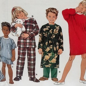 May include: A sewing pattern illustration featuring four children wearing various sleepwear: a blue striped short set, a red and white plaid pajama set, a dark green robe with a dog print over green pants, and a solid red long-sleeve nightgown.