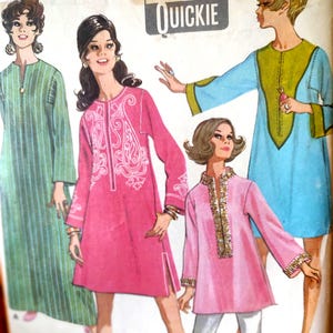 May include: Vintage sewing pattern featuring illustrations of women in colorful tunic dresses. The dresses are in shades of green, pink, and blue, with decorative details. The pattern is labeled "Quickie".