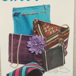 May include: An assortment of handbags in various styles and colors. Includes a turquoise tote bag, a patterned shoulder bag, a quilted purple purse with a flower, a black chain bag, and a striped clutch.