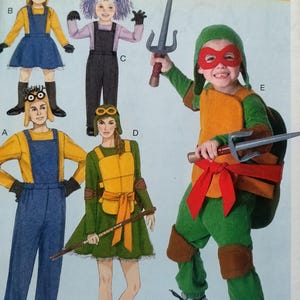 May include: A sewing pattern sheet for costumes featuring five designs: two yellow and blue overall outfits with goggles, one purple-haired jumpsuit, one green dress with a yellow shell and orange sash, and a green turtle jumpsuit with a red mask.