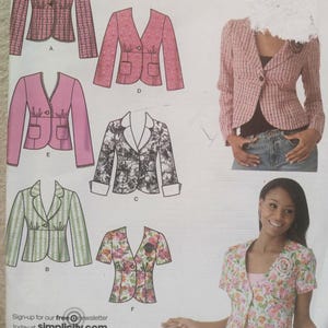 May include: A sewing pattern sheet featuring various jacket designs. The jackets include styles in pink, floral, and striped patterns. The text "Sign-up for our free @newsletter today at simplicity.com" is visible at the bottom.