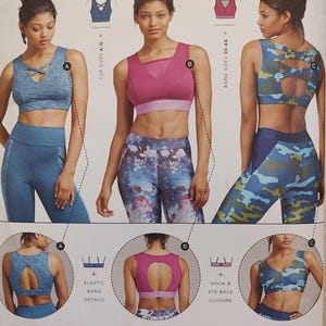 May include: Image of three sports bras in blue, pink, and camouflage patterns. The bras have different designs, including criss-cross straps and open backs. The image also shows matching leggings and details like elastic band and hook & eye back closure.