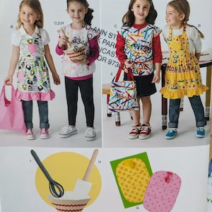 May include: A sewing pattern sheet featuring children's aprons with various prints including cakes, crayons, and gnomes, along with a matching tote bag, a whisk, a spatula, a mixing bowl, and two quilted pot holders with polka dot patterns.