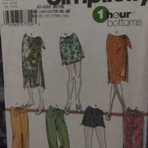 May include: A sewing pattern for making different styles of pants and skirts. The pattern includes instructions for making a pair of wide-leg pants, a pair of slim-fitting pants, a short skirt, a long skirt, and a wrap skirt. The pattern is from Simplicity and is for sizes BB, L-XL. The pattern is called "1 hour bottoms".