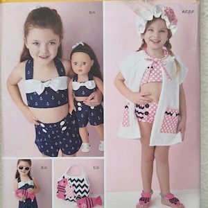 May include: Simplicity pattern 1380 A featuring children's swimwear and accessories. The pattern includes a swimsuit with an anchor print, a matching doll outfit, a beach cover-up, and a tote bag with fish appliqués. Sizes U.S. 3-8.