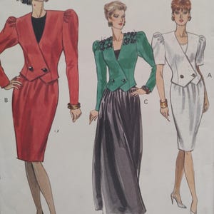 May include: Vintage sewing pattern featuring three women's suits. The suits include a red skirt suit with a double-breasted blazer, a green jacket with a black skirt, and a white skirt suit with a double-breasted blazer. The suits have shoulder pads.