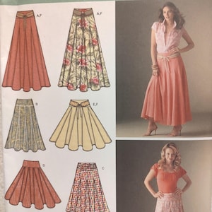 May include: Simplicity sewing pattern 4188 featuring various skirt designs. The pattern includes illustrations of different skirt styles, including a long, flowing skirt and a pleated skirt. The pattern also includes sizing information.