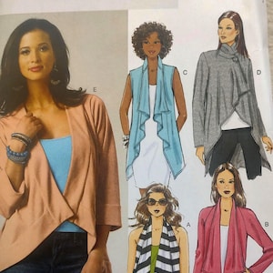May include: Butterick B5789 sewing pattern featuring various jacket and vest designs. The pattern includes illustrations of different styles, including a peach-colored jacket, a blue vest, and a gray wrap jacket. The text "FAST & EASY" is also visible.
