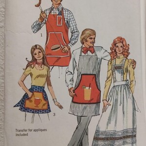 May include: Simplicity pattern 5097 featuring illustrations of aprons. The aprons include a red apron with a pocket and a hamburger design, a striped apron with a pocket and a drink design, and a blue apron with a cup design. The text "ONE SIZE" is visible.