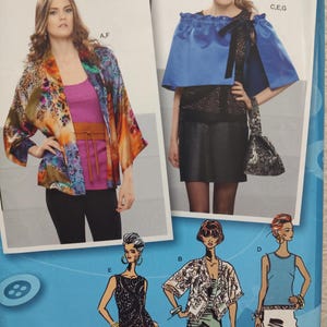 May include: A sewing pattern package featuring images of women's fashion designs. The package includes a colorful kimono-style jacket, a blue cape-like top, and illustrations of various tops and jackets. The package also includes the text "projectrunway.com" and "www.simplicity.com".