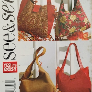 May include: Image of a sewing pattern featuring four different tote bag designs. The bags vary in style and fabric, including a paisley print, floral pattern, corduroy, and solid red. The text "see & sew" and "YES! IT'S easy" are visible.