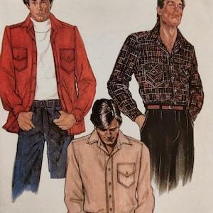 May include: Vintage McCall's sewing pattern featuring three men's shirt designs. The shirts are shown in red, plaid, and light pink. The pattern includes the text "McCall's" and "FROM A NORTON SIMON INC COMPANY".