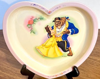 Plato vintage de melamina con forma de corazón de "La Bella y la Bestia" de Disney.