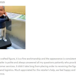May include: A custom bobblehead figure of a golfer with gray hair, wearing a dark blue long-sleeved shirt and light gray trousers. The figure is posed in a golf swing motion, holding a golf club, and is mounted on a square black base.