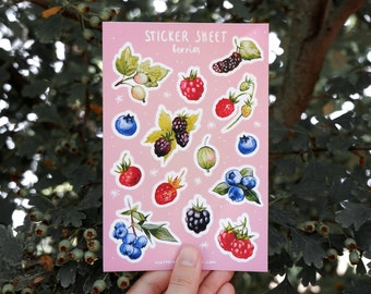 May include: A sticker sheet with the text "Sticker Sheet berries" on a pink background. The sheet features various illustrated berries, including blueberries, blackberries, raspberries, and gooseberries.