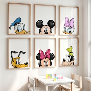 May include: Six framed prints featuring Disney characters: Donald Duck, Mickey Mouse, Daisy Duck, Pluto, Minnie Mouse, and Goofy. Each character is depicted from the chest up, with a white background and a wooden frame. The artwork is suitable for a child's room.