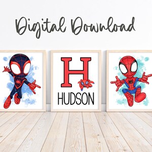 May include: Three framed digital art prints featuring Spider-Man characters. One print has the name "HUDSON" with a red "H". The other two prints feature Spider-Man characters in action poses, set against a blue watercolor background. The words "Digital Download" are at the top.