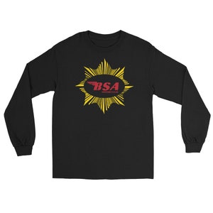 May include: Black long-sleeved t-shirt featuring a yellow starburst design and a red and white logo that reads "BSA Motorcycles".