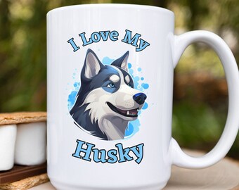 May include: White ceramic coffee mug with a blue and white illustration of a husky dog and the text "I Love My Husky".