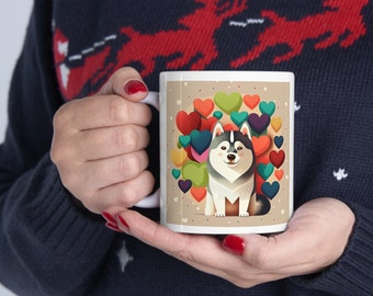 May include: White ceramic mug with a colorful illustration of a husky dog surrounded by hearts. The dog is gray and white with blue eyes.
