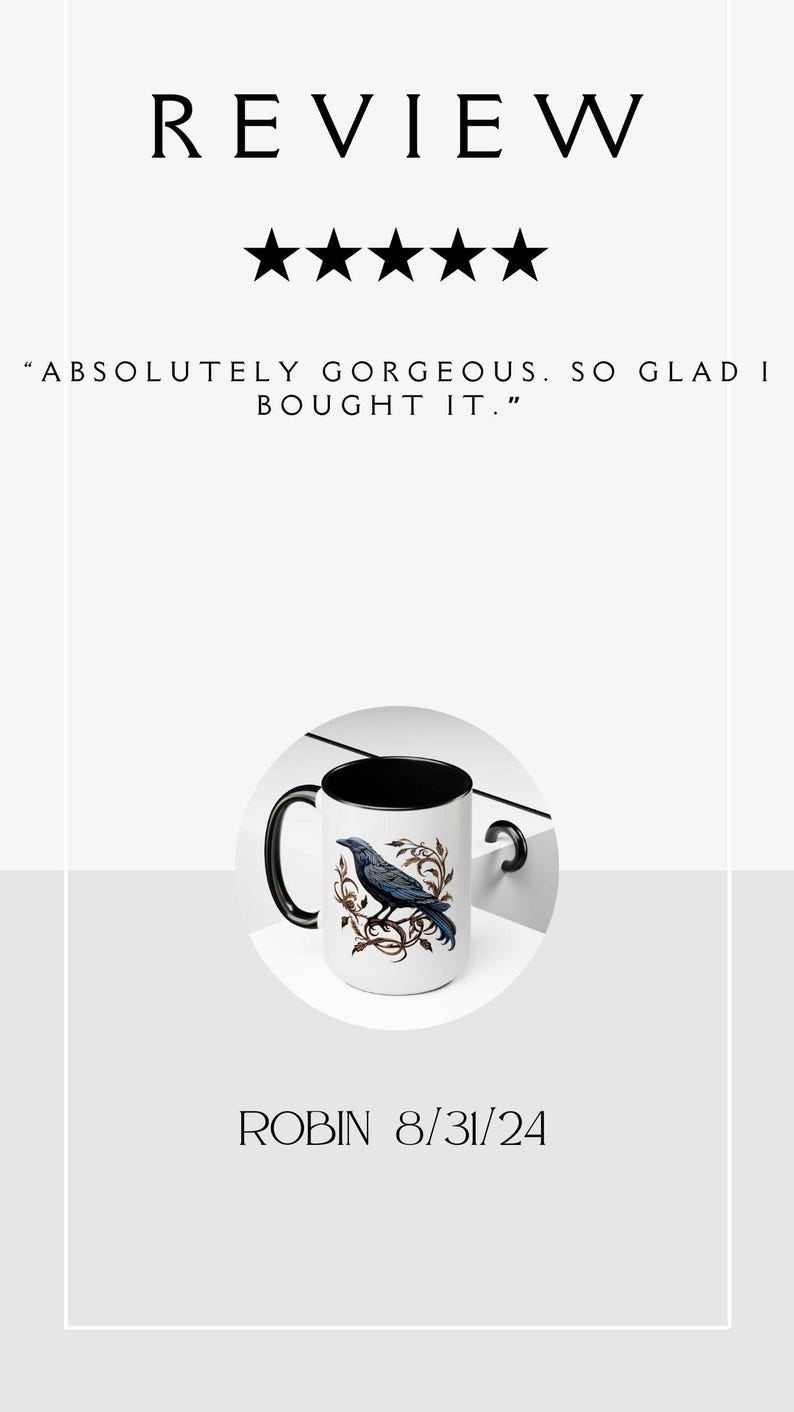 May include: A white ceramic mug with a black rim and handle. The mug features a black raven perched on a branch with brown and gold leaves. The text "ABSOLUTELY GORGEOUS. SO GLAD I BOUGHT IT." is below the image. The mug is on a white surface.  "ROBIN 8/31/24" is below the mug.