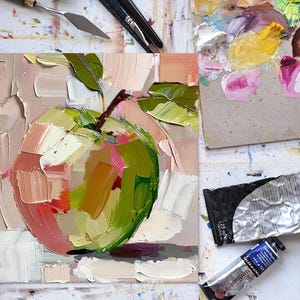 May include: A close-up of a painting of a green apple with pink and yellow highlights. The apple is painted in a loose, impressionistic style with visible brushstrokes. The background is a soft pink.