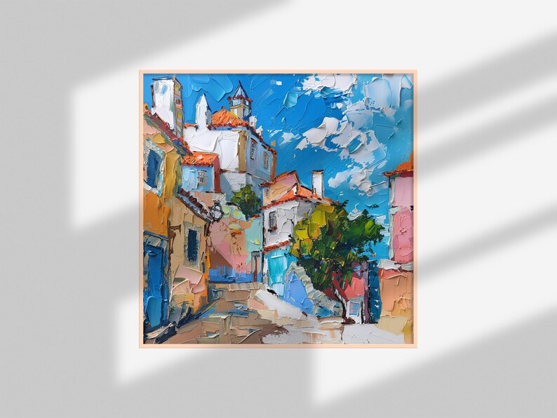 May include: A colorful oil painting depicting a narrow street in a European village. The buildings are painted in shades of yellow, orange, pink, blue, and white. The street is lined with trees and flowers. The sky is a bright blue with fluffy white clouds.