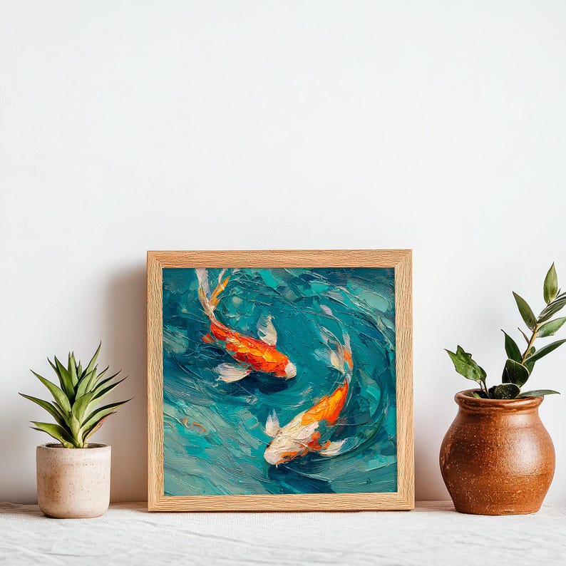 May include: A framed painting depicts two koi fish swimming in a turquoise pond. The fish are orange and white, with detailed brushstrokes creating a textured effect. The artwork is set in a natural wood frame.