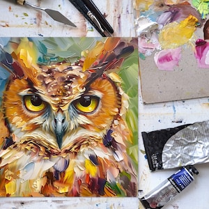 May include: A close-up painting of an owl with yellow eyes. The owl is painted in a colorful, abstract style with a variety of brushstrokes. The background is a blurred green and blue.