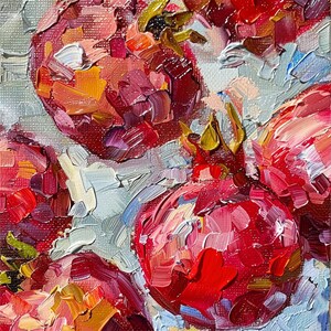 May include: A close-up of a still life painting of red pomegranates. The painting is done in a thick, impasto style, with visible brushstrokes. The pomegranates are arranged in a cluster, with some overlapping. The background is a light blue.