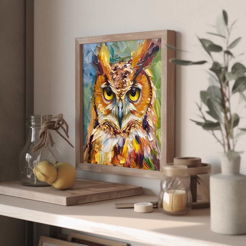 May include: A framed painting of an owl with yellow eyes, brown and orange feathers, and a green and blue background.