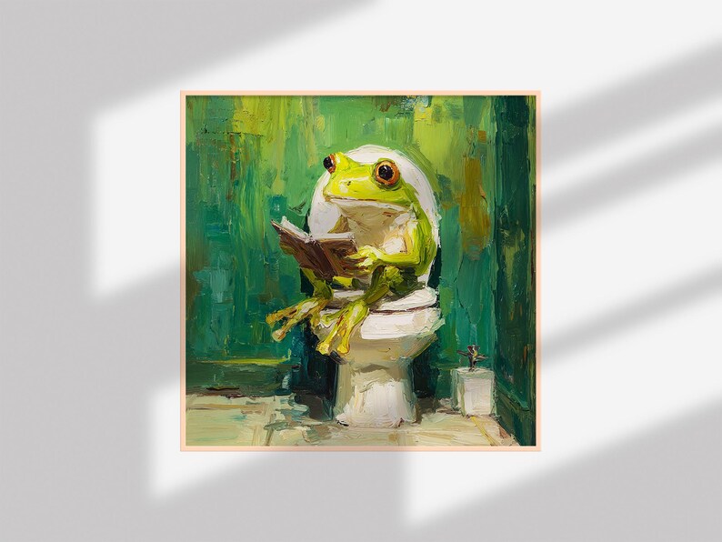 以下が含まれることがあります： 白いトイレで本を読む緑色のカエルの額入り絵画。カエルは黄色の足とオレンジ色の目をしています。背景はテクスチャ加工された緑色で、絵画は気まぐれな芸術的スタイルです。