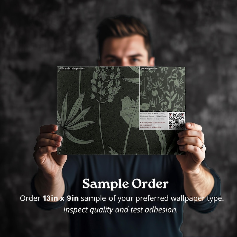 May include: A person is holding a 13 inch by 9 inch sample of wallpaper with a botanical print. The text on the sample reads "100% scale print preview" and "pattern preview". The text below the sample reads "Sample Order" and "Order 13in x 9in sample of your preferred wallpaper type. Inspect quality and test adhesion."