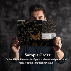 May include: A person is holding a sample of wallpaper with a floral pattern. The sample is 13 inches by 9 inches. The text on the sample reads "100% scale print preview" and "pattern preview".
